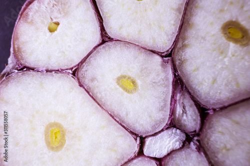 Close-up section of garlic, macro photo. The texture of garlic. Background image. The concept of organic food, vegetarianism. Copyspace.