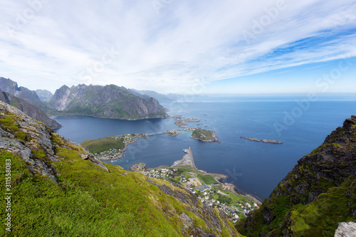Panoramic view of the fishing town of Reine from the top of the Reinebringen viewpoint in the Lofoten Islands, Norway © raland