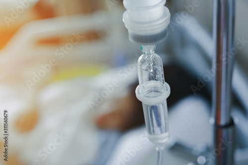 iv infusion saline intravenous injection medicine for healing patient illness in hospital photo