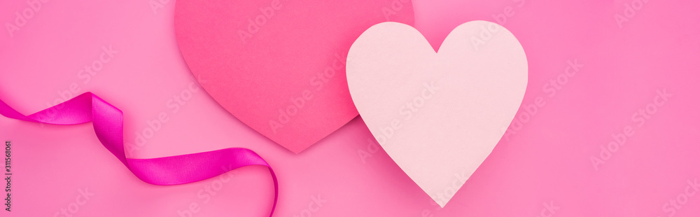 top view of empty paper hearts with ribbon isolated on pink, panoramic shot