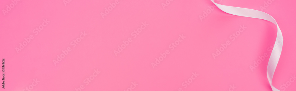top view of satin ribbon isolated on pink, panoramic shot top view of satin ribbon isolated on pink, panoramic shot