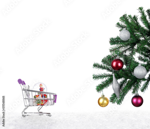 Christmas tree on snow and Santa Claus in shopping cart  on white background