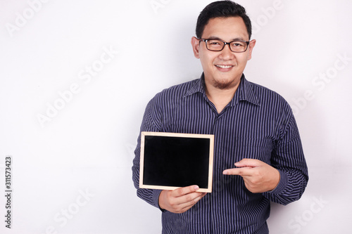 Photos Young Asian Man Smiling and Presenting Empty Copy Space Blackboard