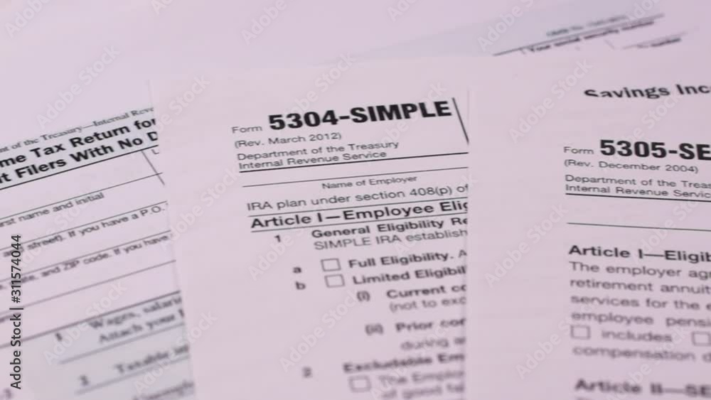 Tax forms 5304-simple, 5305-ser and 1040ez . Close-up Tax forms 5304-simple, 5305-ser and 1040ez . Close-up