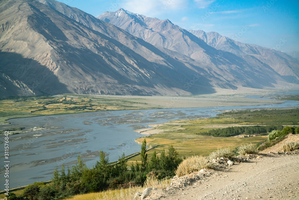 View on Wakhan Corridor in Afghanistan behind the Wakhan river. Taken from Pamir highway on Tajikistan side.