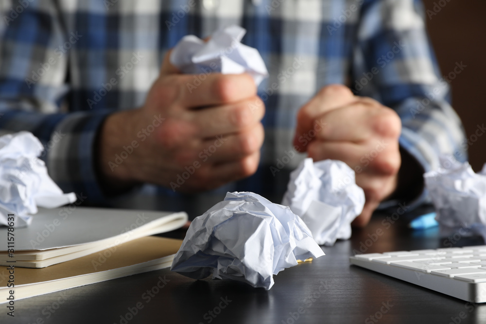 In search of inspiration. Paper balls against man in shirt, close up In search of inspiration. Paper balls against man in shirt, close up