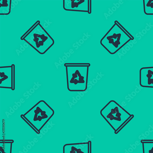 Blue line Recycle bin with recycle symbol icon isolated seamless pattern on green background. Trash can icon. Garbage bin sign. Recycle basket sign. Vector Illustration