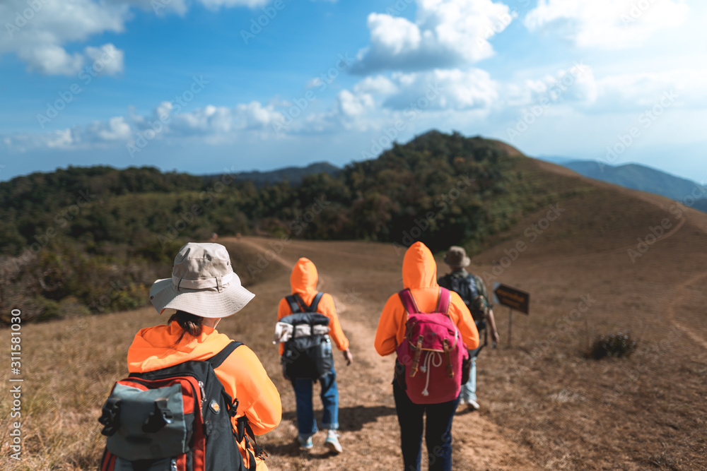 Trekking the backpackers on the golden mountains with bright daytime skies, Mon Jong
