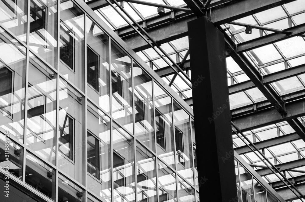 Modern and industrial office building made of beams and glass, with copy space. Modern and industrial office building made of beams and glass, with copy space.