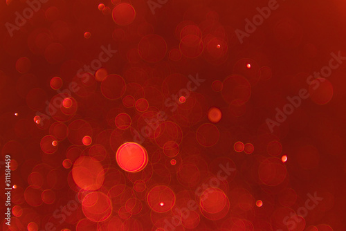 Ruby red bokeh background with soft blur bokeh light effect, background bokeh