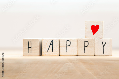Wooden cubes with a Hashtag and the word Happy, smile and heart, social media concept background