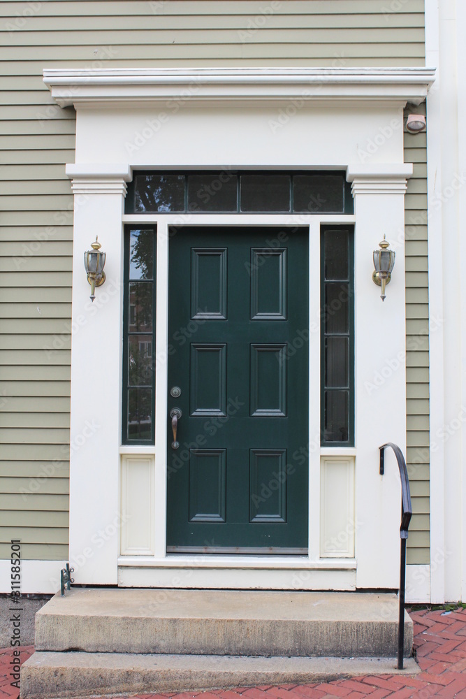 Classic style green wooden door of an american row house in New England Classic style green wooden door of an american row house in New England