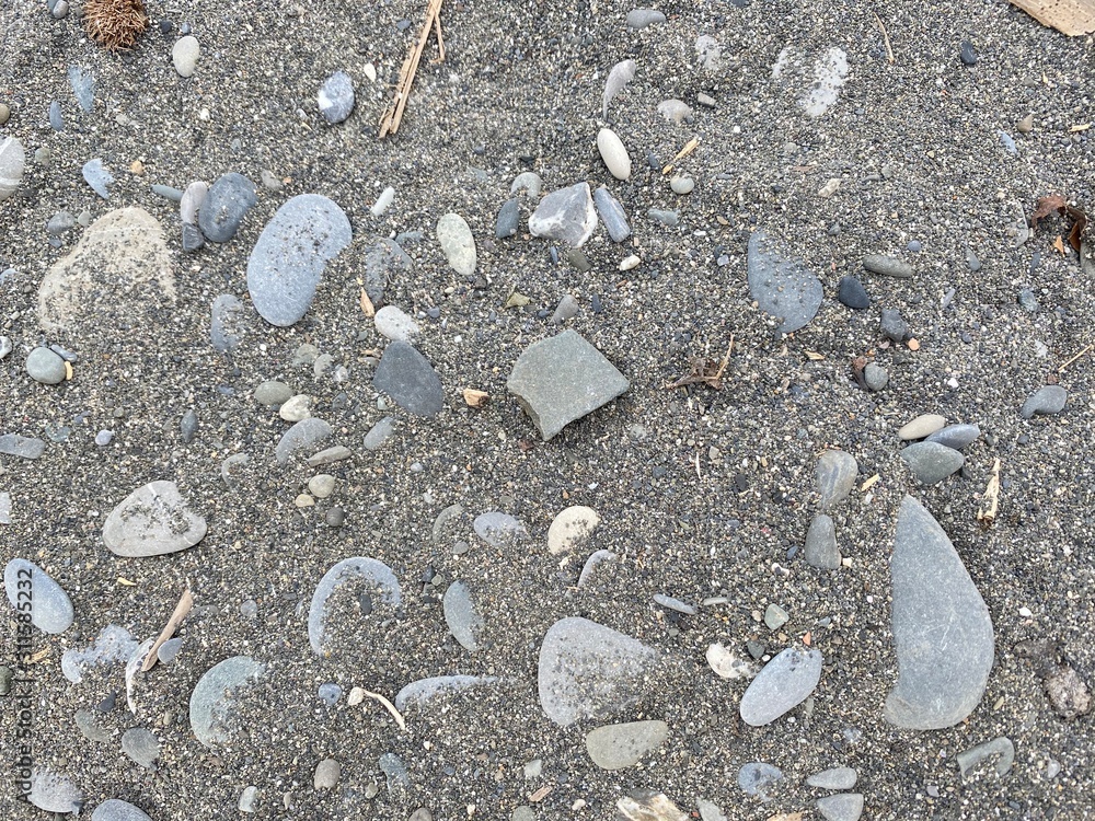 texture of sand and pebbles on the beach texture of sand and pebbles on the beach