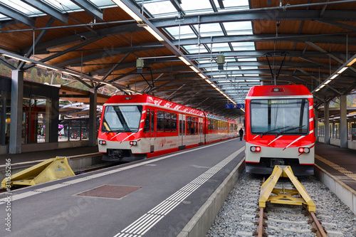 Zermatt, Switzerland-October 21, 2019:The red train stop on railway at station before go to zermatt train station