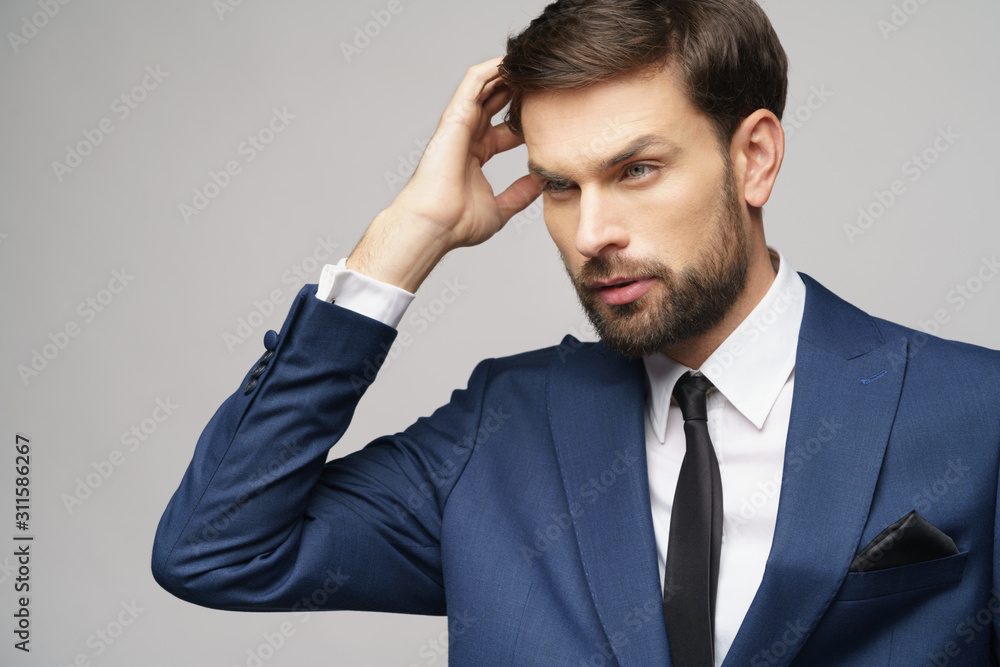 Studuo shot of thinking businessman wearing suit Studuo shot of thinking businessman wearing suit