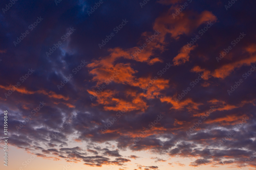 Colorful dawn over the city, beautiful clouds in the sky