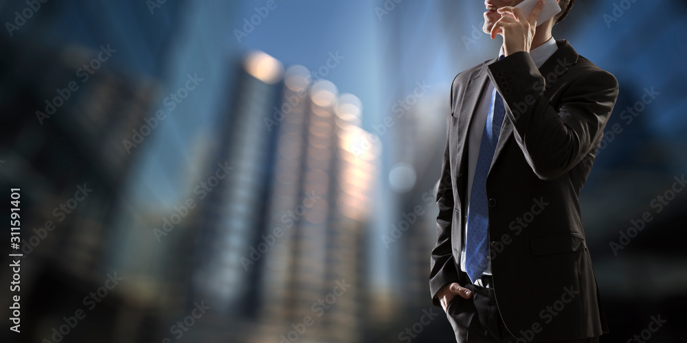 Businessman having mobile talk . Mixed media Businessman having mobile talk . Mixed media
