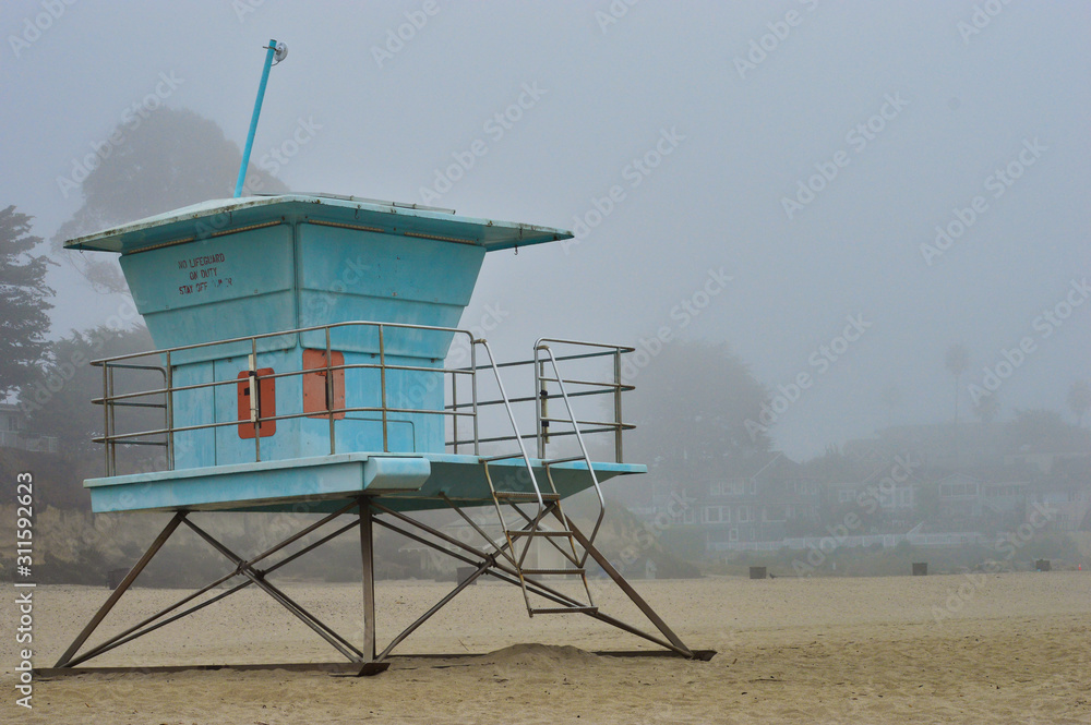 Lifeguards towers on the beach during foggy weather in Santa Cruz, CA Lifeguards towers on the beach during foggy weather in Santa Cruz, CA