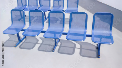 Blue steel seats with shadows on white 