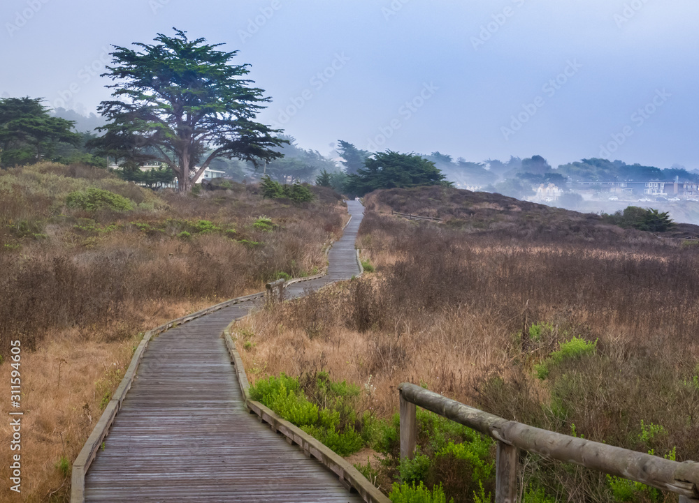 The Moonstone Boardwalk walkway spans the length of Moonstone Beach, along the  Pacific Coast in Cambria, California, a popular weekend getaway.   