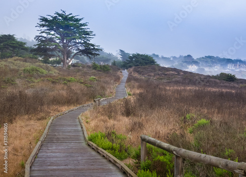 The Moonstone Boardwalk walkway spans the length of Moonstone Beach, along the Pacific Coast in Cambria, California, a popular weekend getaway. 