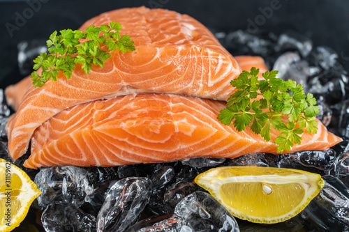Salmon on ice with herbs and lemon