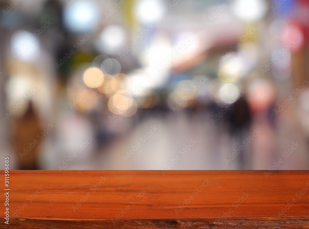 Empty dark wooden table in front of abstract blurred background of cafe coffee shop city night light. can be used for display or montage your products - Image Empty dark wooden table in front of abstract blurred background of cafe coffee shop city night light. can be used for display or montage your products - Image