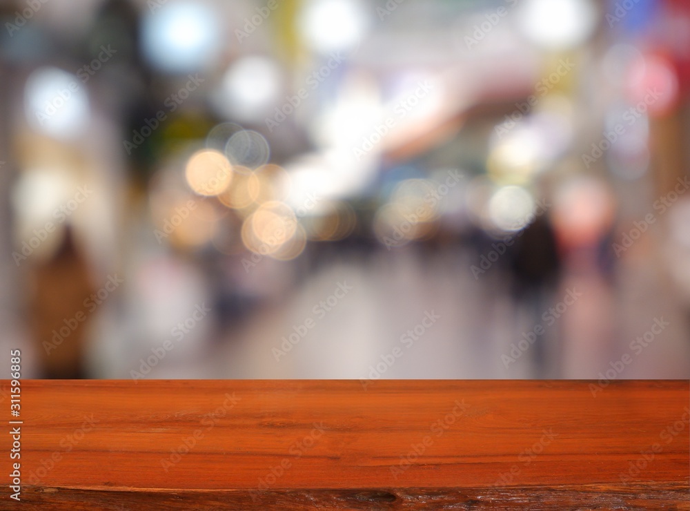 Empty dark wooden table in front of abstract blurred background of cafe coffee shop city night light. can be used for display or montage your products - Image