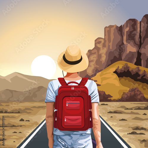 beautiful western sunset landscape with traveler man standing with hat and red backpack