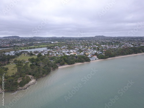 Waiheke Island, Auckland / New Zealand - December 24, 2019: The paradise island Waiheke with its stunning beaches, coastlines, hill terrains and vineyards photo