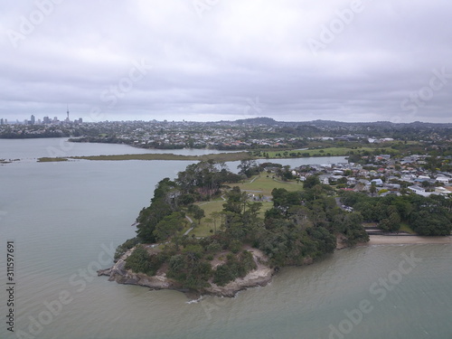 Waiheke Island, Auckland / New Zealand - December 24, 2019: The paradise island Waiheke with its stunning beaches, coastlines, hill terrains and vineyards photo