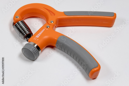 hand expander for training the muscles of the hand on white background