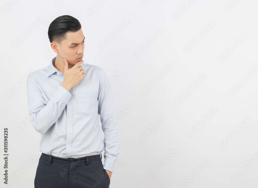 Young handsome asian business man thinking an idea while looking up isolated on white background. Young handsome asian business man thinking an idea while looking up isolated on white background.