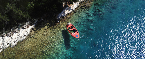 Aerial drone ultra wide photo of sail boats docked in paradise bay of Fiskardo, Kefalonia island, Ionian, Greece