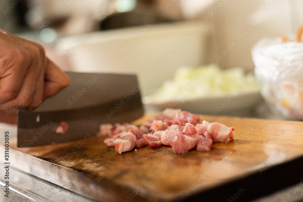 cut raw pork on wooden table