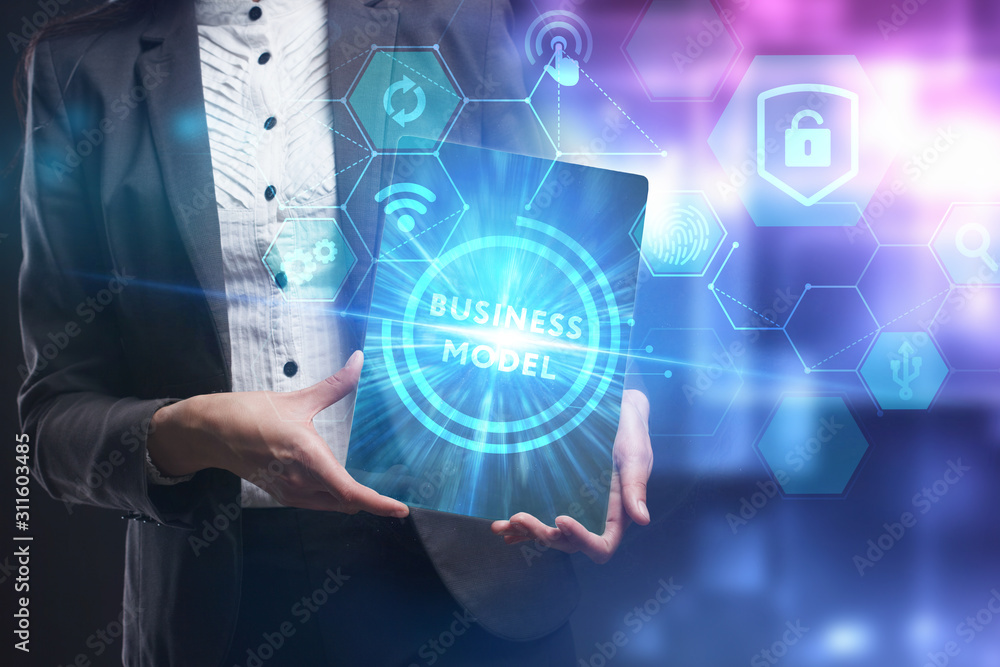 Obraz premium Business, Technology, Internet and network concept. Young businessman working on a virtual screen of the future and sees the inscription: Business model