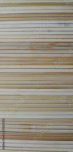 Rural background from light wooden planks in horizontal parallel pattern. Wood wall facade fragment texture.
