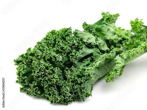 Green kale leaves  one of the super foods  isolated on a white background  beneficial for health lovers. High in antioxidants
