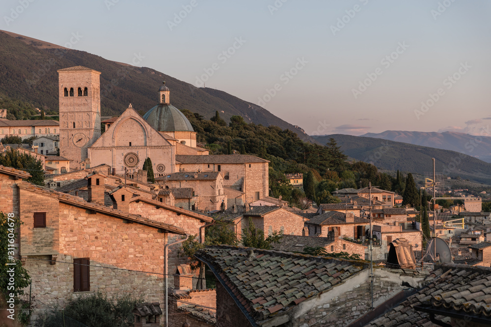 Golden hour light on buildings in Assisi