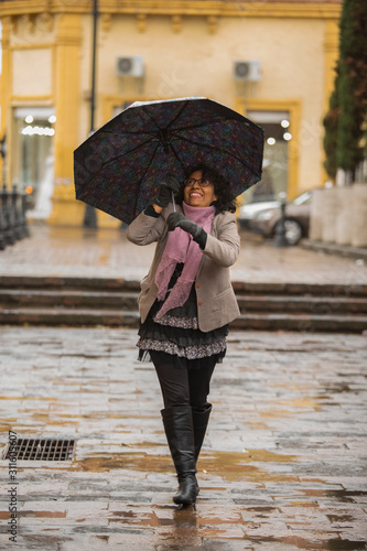pretty brunette woman in a rainy day