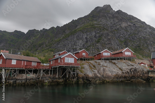 Red Rorbuers and a mountain peak in Lofoten, Norway photo