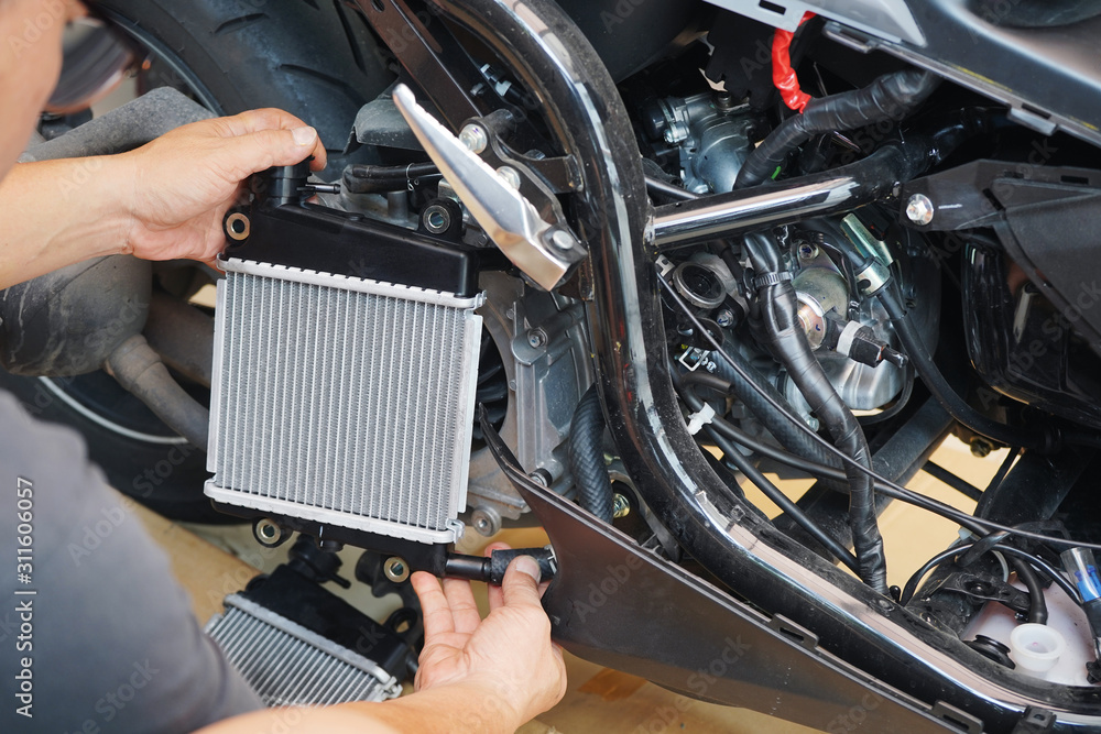 Expert technician install a radiator to motorcycle or scooter,The