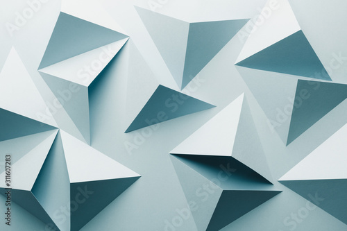 Abstract pattern made of colored paper  light blue background