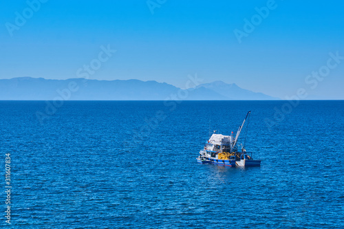 Fishing boat on the water catching fish