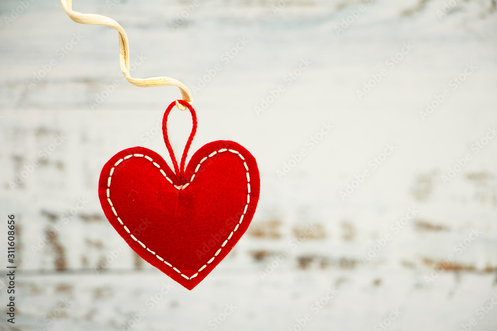 Fototapeta premium Valentine's day greeting card. Red heart on a wooden white blue background. Creative card before Valentine's Day.