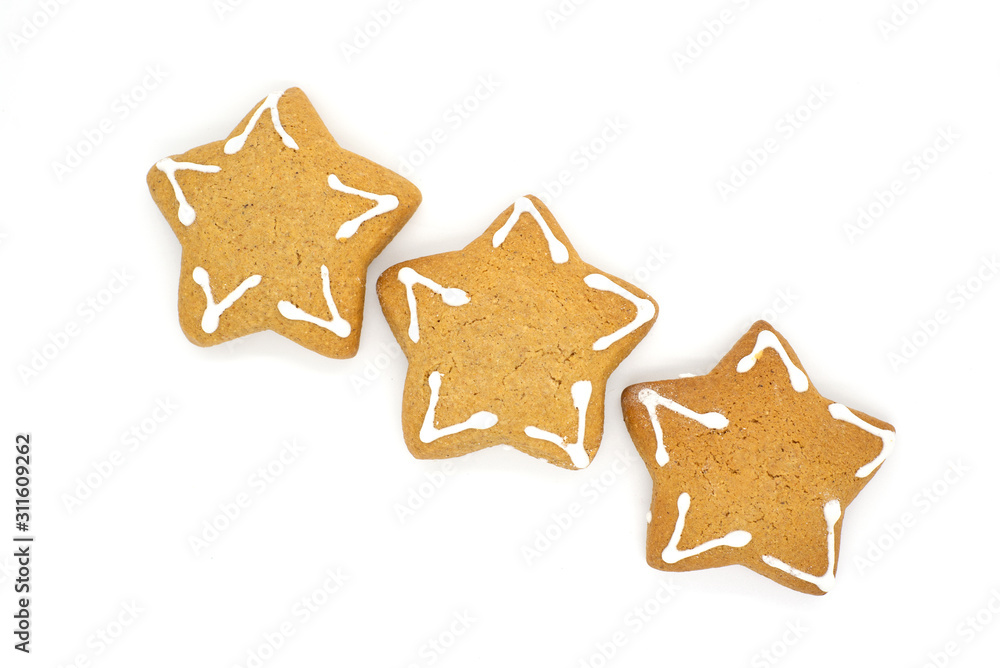 three gingerbread cookies in the shape of a star on a white background three gingerbread cookies in the shape of a star on a white background