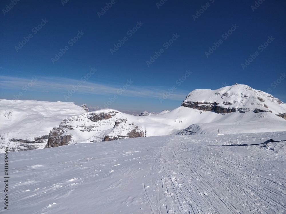 winter landscape with mountains and blue sky
