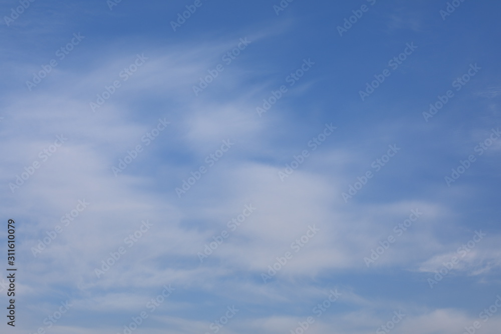 winter white clouds on blue sky background