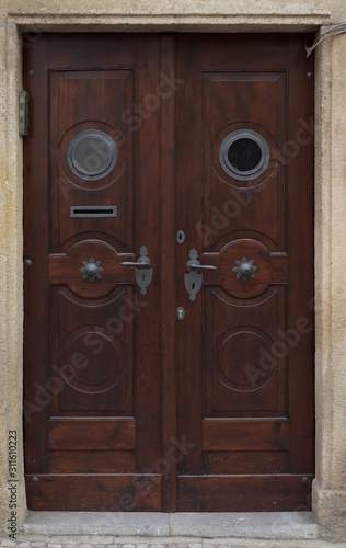 Wooden door with forged elements in high resolution