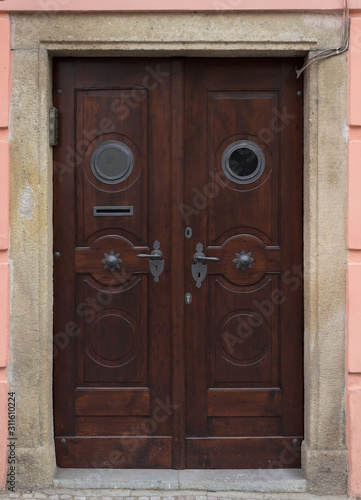 Wooden door with forged elements in high resolution